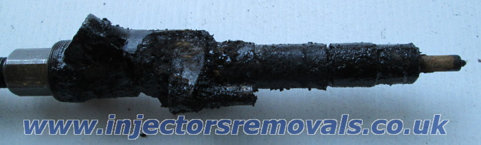 Removed injector flooded with black glop from
                axhaust gasses